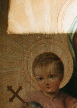 Fragment lica obrazu. Stan podczas usuwania pociemniałego werniksu